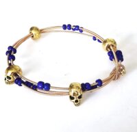 gold skulls blue guitar string