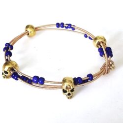 gold skulls blue guitar string